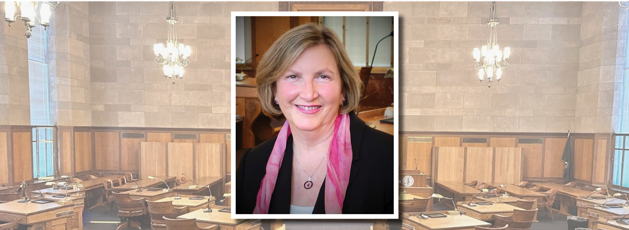 photo of Legislator Nancy Barr with chamber in the background