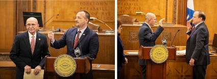 Two images of an official swearing-in ceremony at the County Board of Legislators. The first image shows two men standing at a podium, one speaking into a microphone. The second image shows one man raising his hand to take an oath while another administers it.